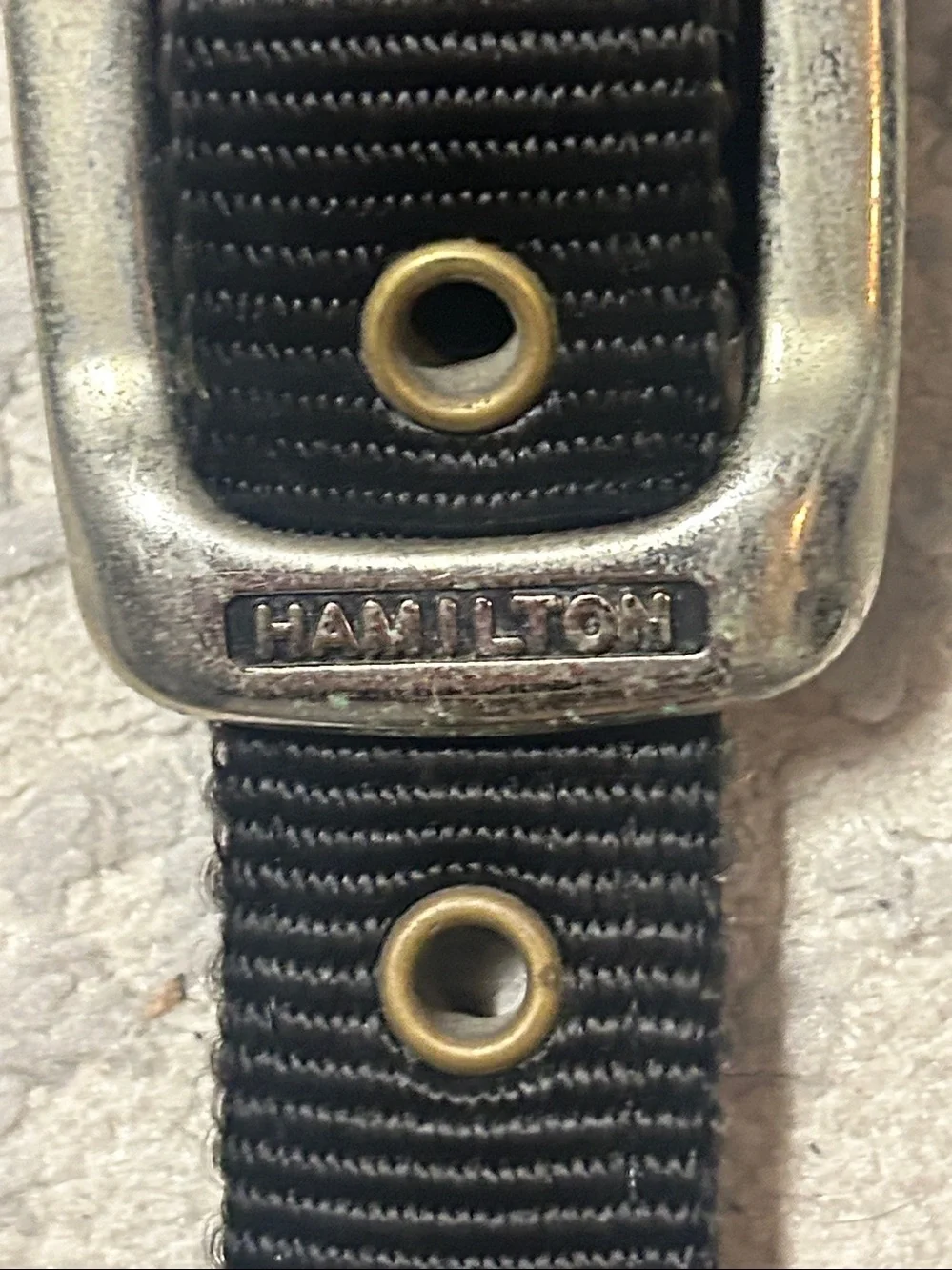 Used Bag strap hardware close-up
